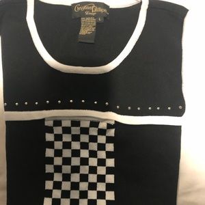 Sleeveless sweater By: Christian Phillipe